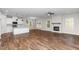 Spacious living area with eat-in kitchen, fireplace, light-filled windows and open floor plan at 186 N Ashe Ave, Dunn, NC 28334