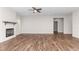Bright living room with fireplace and hardwood floors at 186 N Ashe Ave, Dunn, NC 28334
