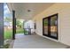 Covered patio with concrete flooring and black support beams, perfect for outdoor seating and relaxation at 186 N Ashe Ave, Dunn, NC 28334