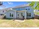 Exterior of light blue home with large backyard and basketball hoop in driveway at 2008 Campana Dr, Raleigh, NC 27603