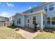 Backyard with patio, grilling area, and blue siding on the two-story home and privacy fence at 2008 Campana Dr, Raleigh, NC 27603