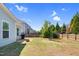 Spacious backyard featuring a grill, patio, firepit, and basketball hoop, perfect for outdoor activities and entertaining at 2008 Campana Dr, Raleigh, NC 27603