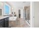 Beautiful primary bath featuring a soaking tub, tiled shower, and dual vanities at 2008 Campana Dr, Raleigh, NC 27603