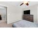 Bedroom featuring a dresser and a TV, offering a comfortable and functional space for relaxation at 2008 Campana Dr, Raleigh, NC 27603