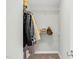 Organized closet with hanging clothes, shelves, and accessories for efficient storage and convenience at 2008 Campana Dr, Raleigh, NC 27603