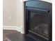 Contemporary fireplace with black hearth and mantel, framed by white trim, adds warmth to the living space at 2008 Campana Dr, Raleigh, NC 27603