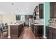 Spacious kitchen with dark cabinetry, stainless steel appliances and a large granite island at 2008 Campana Dr, Raleigh, NC 27603