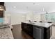 Island kitchen with granite countertop, modern appliances, and pendant lighting with room for dining at 2008 Campana Dr, Raleigh, NC 27603