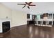 Spacious living room with a fireplace, ceiling fan, and view into the kitchen with a large island at 2008 Campana Dr, Raleigh, NC 27603