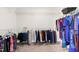 Spacious walk-in closet with ample hanging space and wire shelving, perfect for organized storage at 2008 Campana Dr, Raleigh, NC 27603