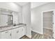 Bathroom featuring a large vanity with granite countertops and modern finishes at 206 Jetson Creek Way, Youngsville, NC 27596