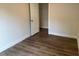 The bedroom features new wood flooring and a white door at 209 King St, Oxford, NC 27565