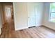 This bedroom features new floors, fresh paint and a door at 209 King St, Oxford, NC 27565