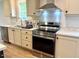Bright kitchen features stainless steel appliances, plenty of counter space at 209 King St, Oxford, NC 27565