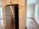 Kitchen featuring stainless steel refrigerator and shaker cabinets at 209 King St, Oxford, NC 27565