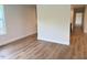 Bright living room with views to the outside and wood-look floors at 209 King St, Oxford, NC 27565