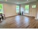 Bright living room features new flooring and plenty of natural light at 209 King St, Oxford, NC 27565