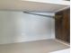 Interior view of storage area with white walls and wood flooring at 209 King St, Oxford, NC 27565