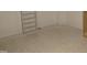 Unfinished basement showing bare concrete floors, white walls, and a built-in bookshelf at 2590 Silas Peak Ln, Apex, NC 27523