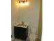 Bathroom with a dark vanity, a white marble countertop, and an awaiting new toilet at 2590 Silas Peak Ln, Apex, NC 27523