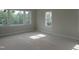 Bright bedroom featuring multiple windows that provide lots of natural light at 2590 Silas Peak Ln, Apex, NC 27523