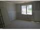 Bright bedroom featuring a large window and plenty of space, offering a serene retreat for rest and relaxation at 2590 Silas Peak Ln, Apex, NC 27523
