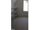 Well-lit closet space, complete with shelving, offering convenient storage solutions and maximizing space at 2590 Silas Peak Ln, Apex, NC 27523
