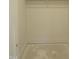 Walk-in closet with a white closet rod and light colored walls and flooring at 2590 Silas Peak Ln, Apex, NC 27523