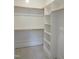 Walk-in closet with white shelving and rods offering ample storage space at 2590 Silas Peak Ln, Apex, NC 27523