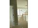 Open foyer area featuring a staircase with wood railing and modern light fixture at 2590 Silas Peak Ln, Apex, NC 27523