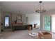 Open-concept kitchen design with a kitchen island, modern lighting, and arched doorways at 2590 Silas Peak Ln, Apex, NC 27523