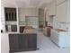Unfinished kitchen featuring a central island, custom cabinetry, and ample space, ready for personalization and culinary adventures at 2590 Silas Peak Ln, Apex, NC 27523