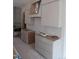 Spacious kitchen area showcases modern cabinets, drawers, and a contemporary ventilation system at 2590 Silas Peak Ln, Apex, NC 27523