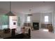 Spacious living room features a fireplace, built-in shelves, and sliding doors to the outdoor area at 2590 Silas Peak Ln, Apex, NC 27523