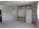 Spacious living room featuring built-in shelving and ample natural light, perfect for relaxation and entertainment at 2590 Silas Peak Ln, Apex, NC 27523