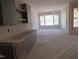 Modern living area with cabinetry and ample natural light, creating a stylish and inviting space at 2590 Silas Peak Ln, Apex, NC 27523