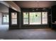 Spacious living room with ample natural light and unfinished floors at 2590 Silas Peak Ln, Apex, NC 27523