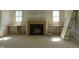 Living room with fireplace and built-ins, ready for customization, awaiting personalization at 2590 Silas Peak Ln, Apex, NC 27523