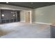 Unfinished living room features gray walls, dark ceiling, and a unique light fixture at 2590 Silas Peak Ln, Apex, NC 27523