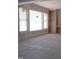 Bright living room with large windows, providing ample natural light and creating a warm, inviting atmosphere at 2590 Silas Peak Ln, Apex, NC 27523