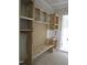 The unfinished mudroom area features custom built-ins, creating a functional and organized space for the whole Gathering at 2590 Silas Peak Ln, Apex, NC 27523