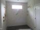 Luxurious walk-in shower with modern gold fixtures and a tiled showerhead at 2590 Silas Peak Ln, Apex, NC 27523