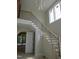 Staircase with contemporary wood and black metal railing in a light, bright open floorplan at 2590 Silas Peak Ln, Apex, NC 27523