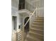 View of new wooden staircase with black metal railings in a bright, modern home at 2590 Silas Peak Ln, Apex, NC 27523
