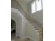 Elegant staircase with modern railing, offering a stylish transition between floors and enhancing the home's aesthetic at 2590 Silas Peak Ln, Apex, NC 27523