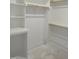 Walk-in closet offers ample storage space with wooden racks at 2590 Silas Peak Ln, Apex, NC 27523