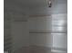 Large walk-in closet with white built-in shelves providing generous storage at 2590 Silas Peak Ln, Apex, NC 27523