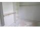 Spacious walk-in closet featuring custom shelving, hanging rods, and a functional layout at 2590 Silas Peak Ln, Apex, NC 27523