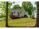 Spacious backyard with a wooden deck, offering a serene outdoor retreat, perfect for relaxation at 27 Ashley Woods Ct, Clayton, NC 27527