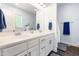 Bathroom featuring double sink vanity, white cabinetry, and elegant fixtures at 27 Ashley Woods Ct, Clayton, NC 27527